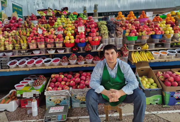 Fruit stall with a seller in Kazakhstan